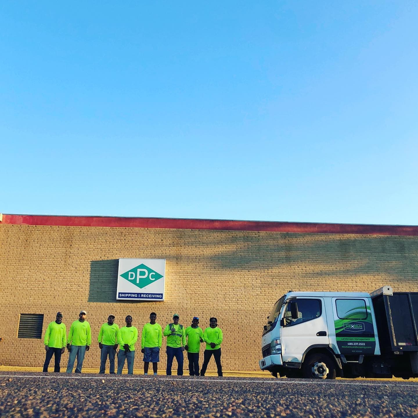 NexGen’s landscape crew beside a branded work truck