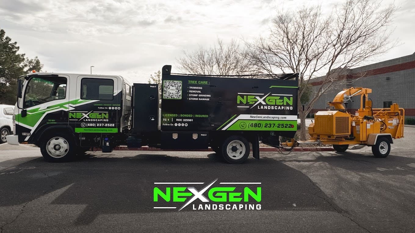 NexGen branded service truck and tree-care chipper on a commercial site in Phoenix, Arizona